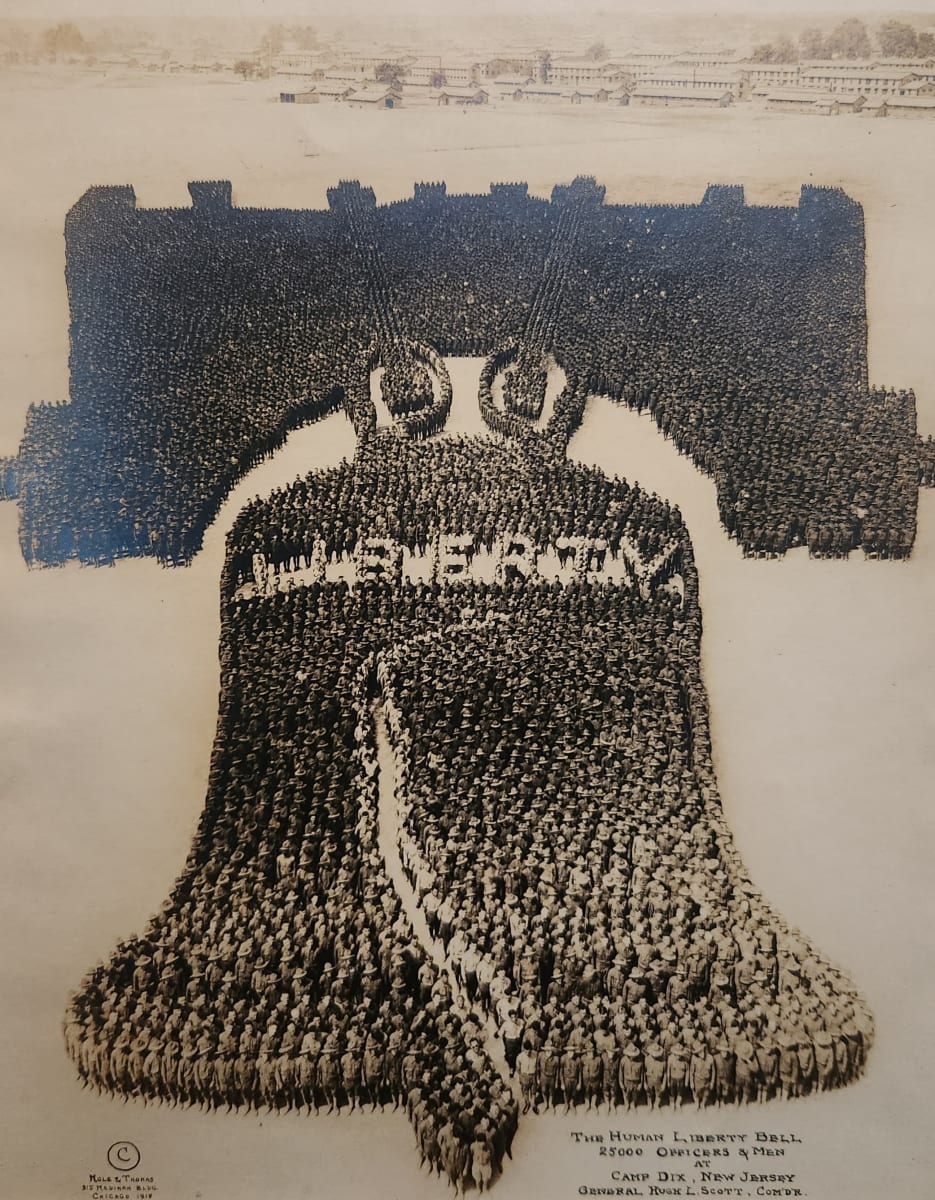 Liberty Bell formed by 25000 men: Mole and Thomas, 1918  Image: Monumental scale performance art photography. Series of photos each involving thousands of soldiers arranged to create perceptual depth illusion when photographed from a high tower. Used for WWI fund raising.