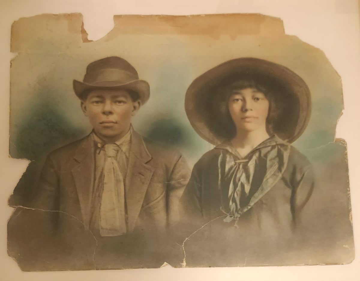 Folksy man and woman in great hats 