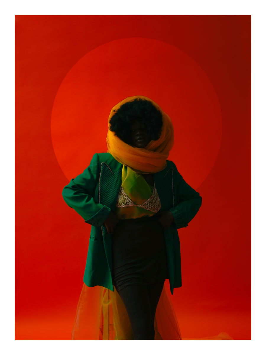 Orange Moon by Tumi Adeleye  Image: A portrait of a girl who dreams she is in fact an orange moon. As an artist and a pisces I often struggle with escapist thoughts, struggling to ground myself to reality. In some cases, I capture where I'd rather be or who I'd rather be.