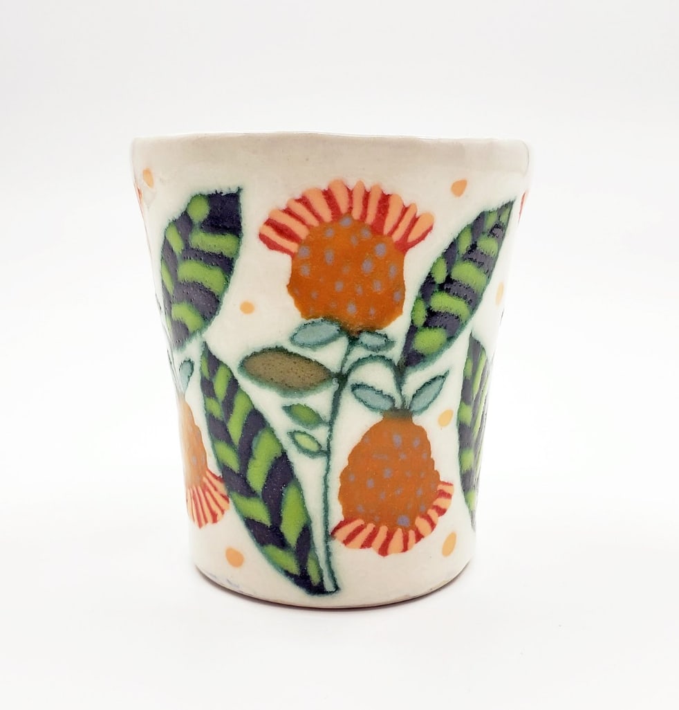 Vessel with orange flowers and striped fringe by Marissa Y. Alexander 
