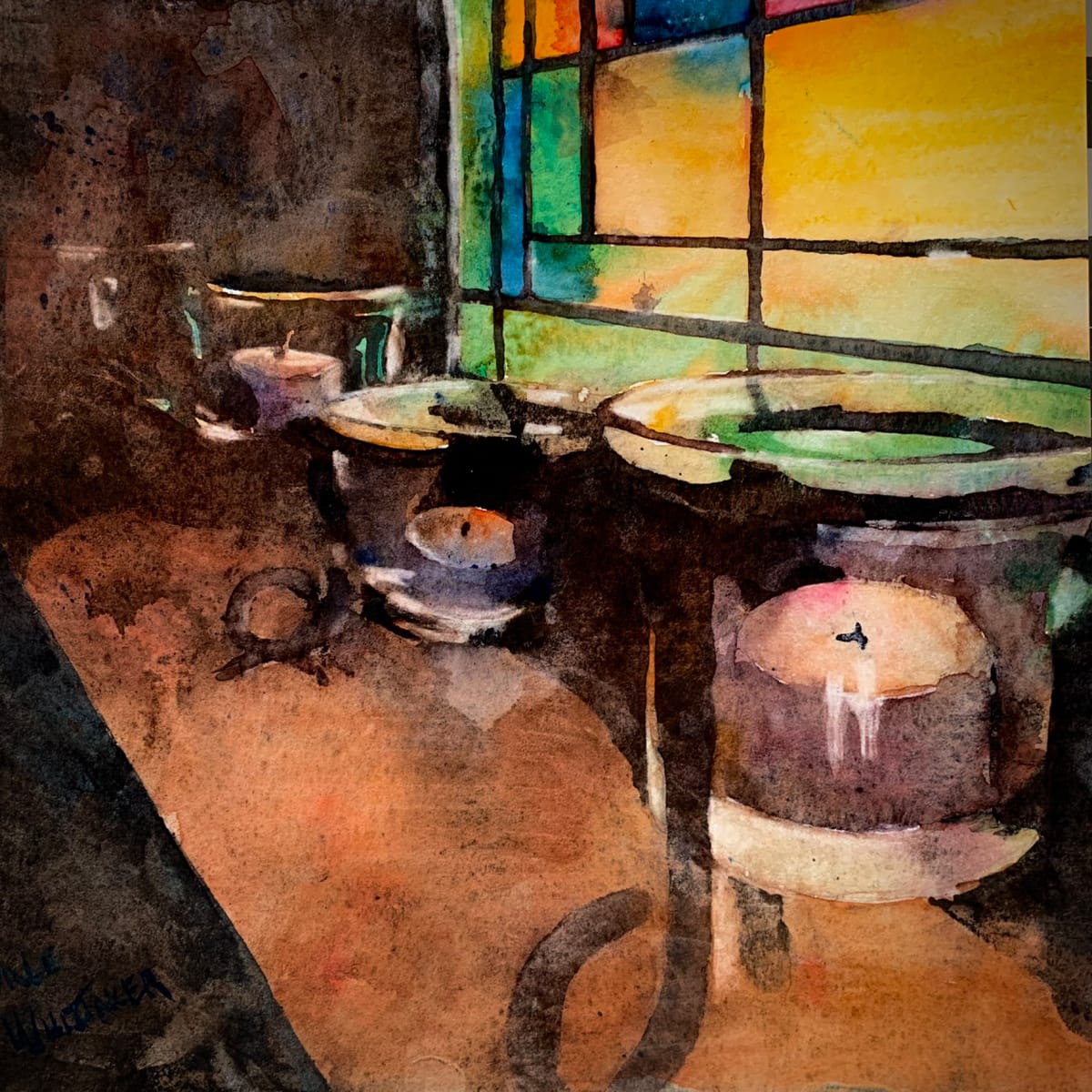 Inside the Island Church by Dale Whittaker  Image: West light filters through the stained glass windows of St. John, the island church, falling on votives waiting to be lit again.