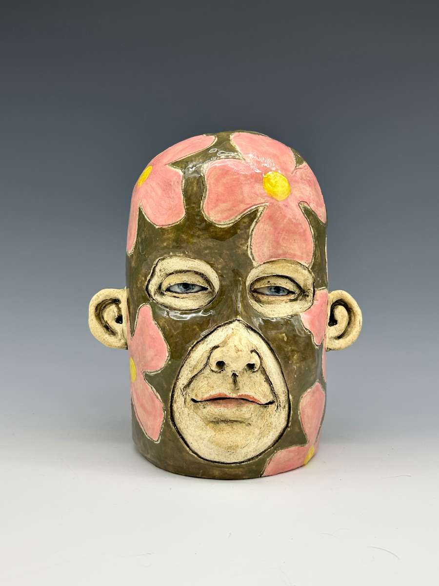 Pink flowers on green cap by Jeanine Pennell 