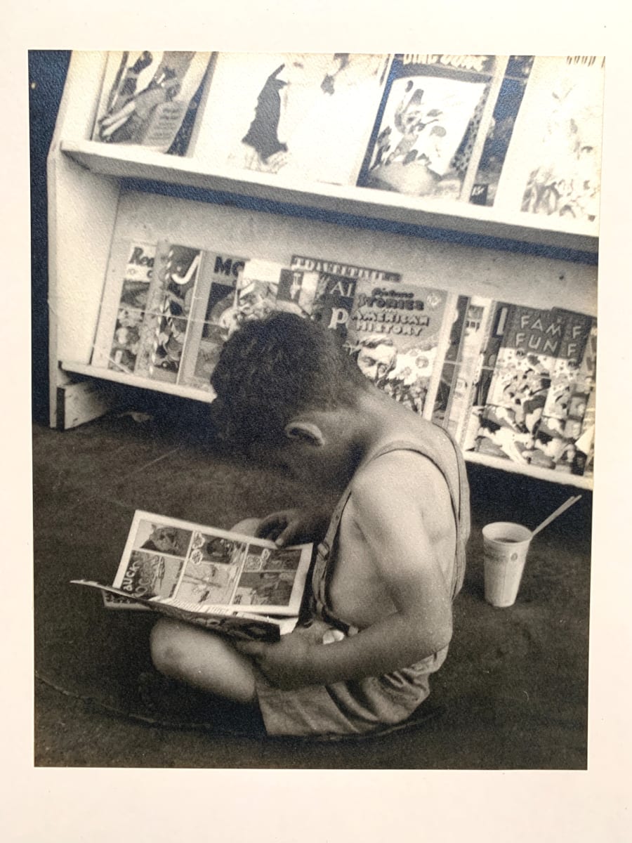 "Child Reading Comics" by Margaret Daughtry 