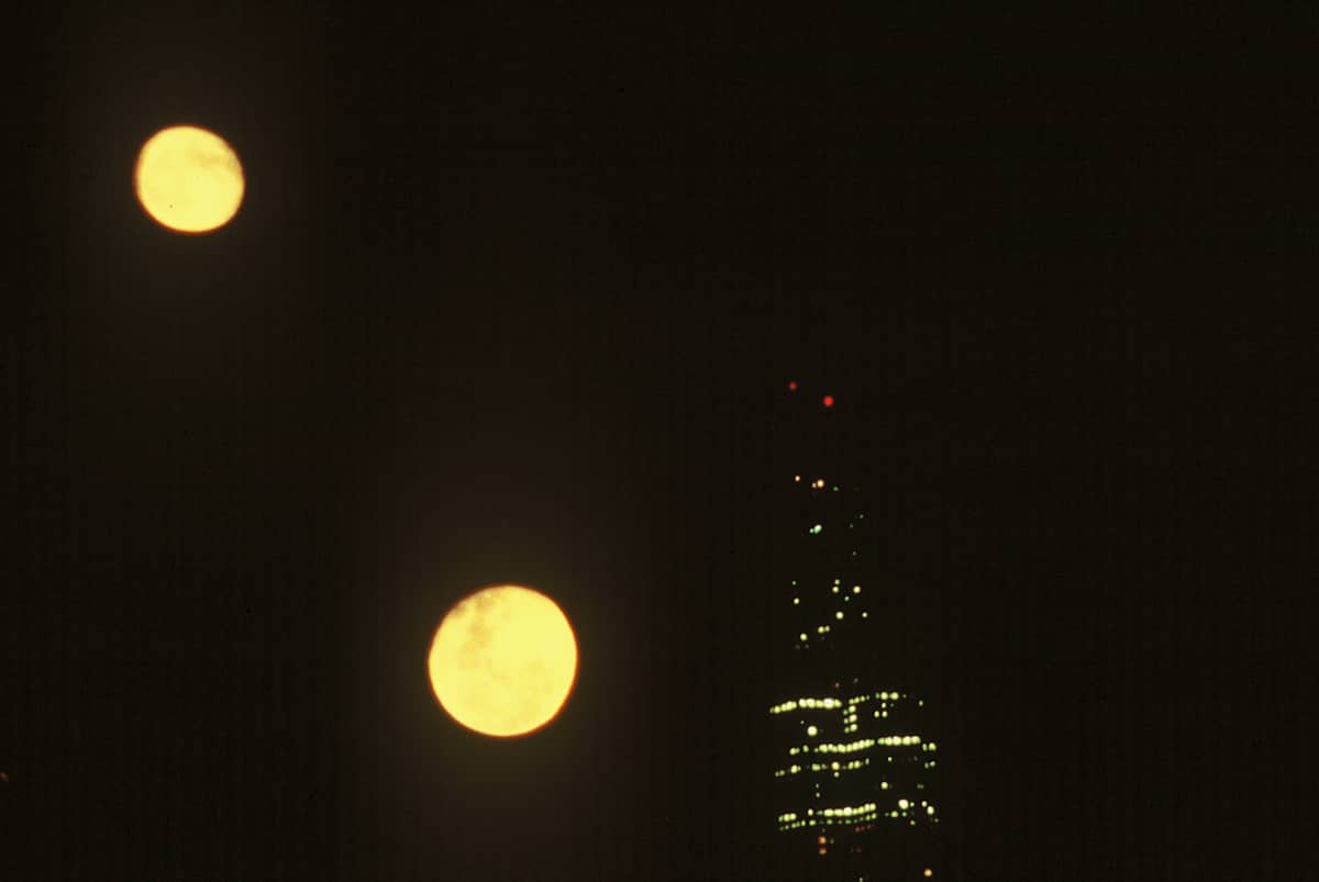 TWO  MOONS OVER SEARS TOWER by charles elwert 
