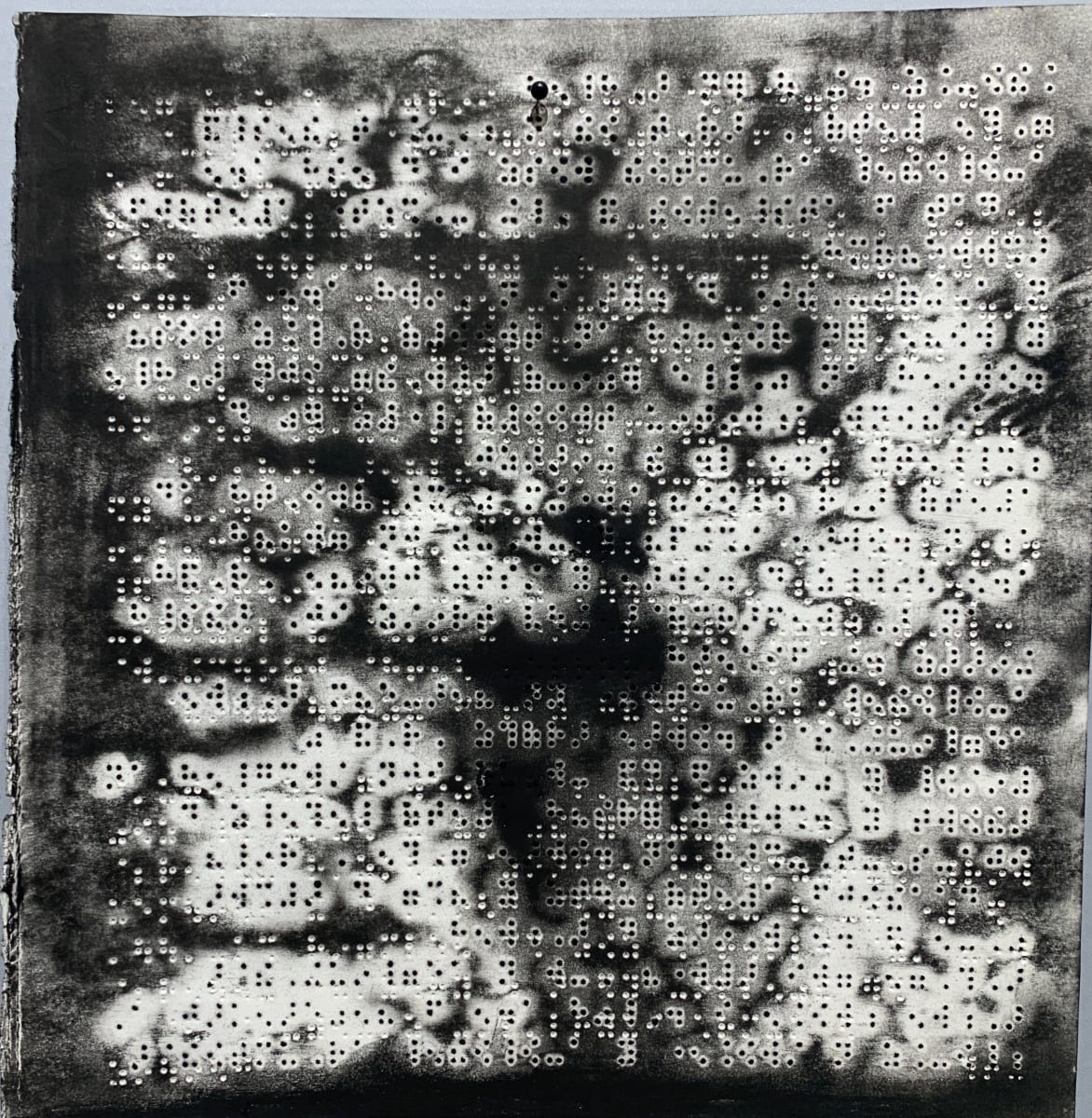 Gridlock by Maria Mimma Scarpini  Image: This is part of a series of charcoal drawings on Braille embossed magazine paper executed mostly with frottage technique.