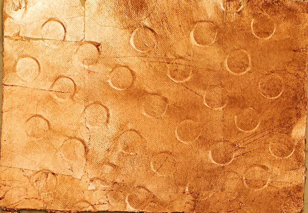 Gilt Nostalgia: MTR by Elizabeth Briel  Image: "Gilt Nostalgia", embossed handmade paper with pure copper leaf, bamboo scaffolding with construction mesh, LEDs, vintage sudare blinds, 2024

Each blind embossed print the physical record of a meeting between architecture and the artist’s body.

This installation marks a continuing preoccupation with life patterns in two cities: Paris and Hong Kong. These grooves and tiles mark the consciousness of residents in varied ways: our feet, neighborhoods, and identities.

Having been designed for a previous century, they provoke a sense of nostalgia or decay in those of us who live and work among them, a subtext to our lives. Though often ignored, they become an indelible part of our memories.