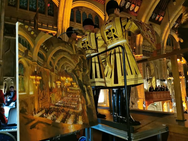 The Lord Mayor's Banquet by Rob Pointon  Image: Photograph from the evening of the banquet showing the painting in production alongside the State Trumpeters playing the fanfare.