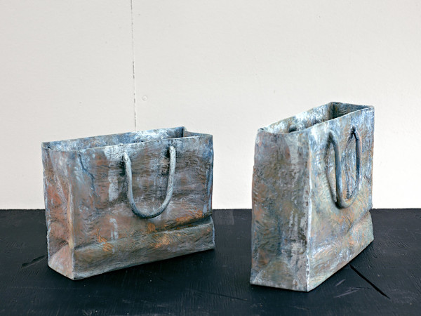 two paper bags full of water by Duncan Hewitt