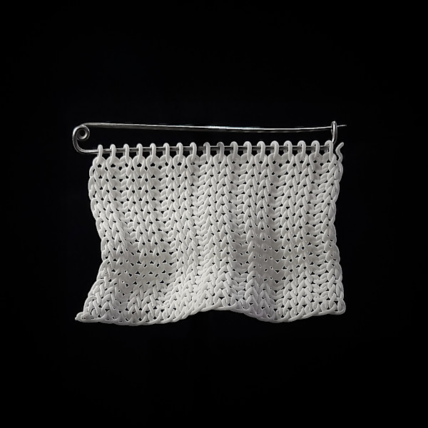 Knitted brooch by Hesti Wade
