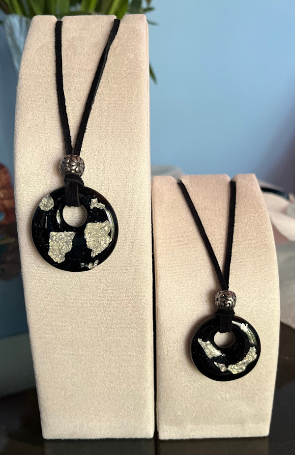Black opalescent and silver foil pendants by Julie Root Sawyer, Image 1.
