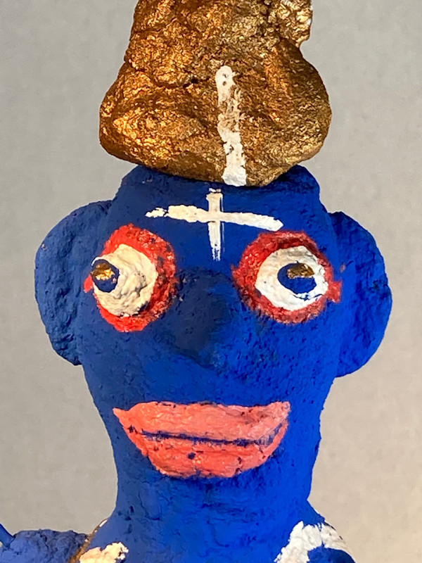 Blue Face with white cross and gold hat by Jennifer Taylor