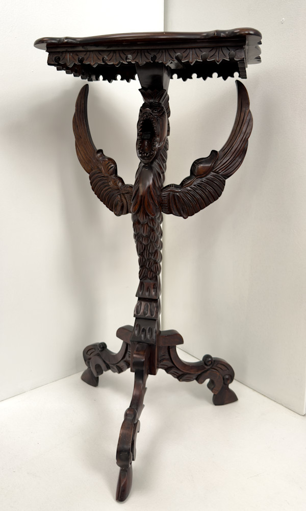 Small table with winged creature