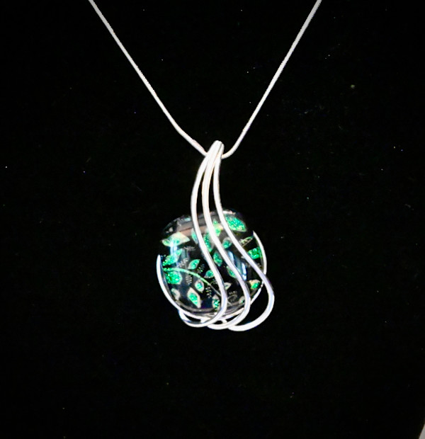 Dichroic teal green leaves on black pendant by Susan Mason