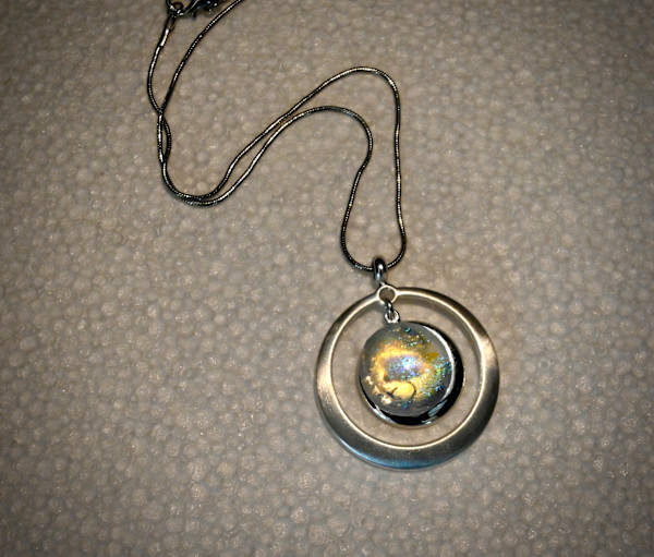 Circle within a circle opalescent fused glass necklace by Susan Mason