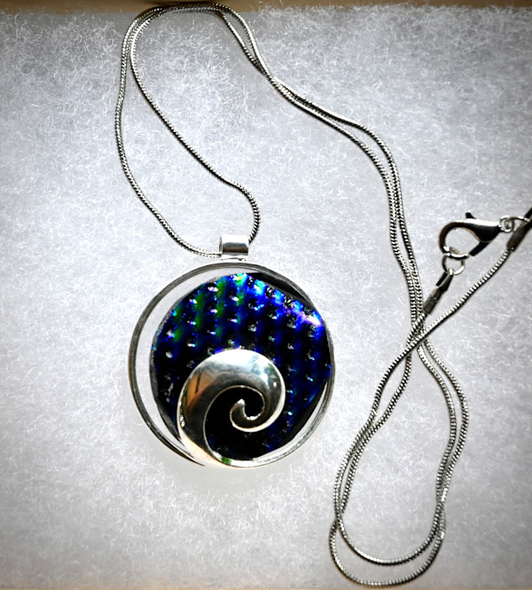 Blue textured dichroic fused glass swirl pendant by Susan Mason
