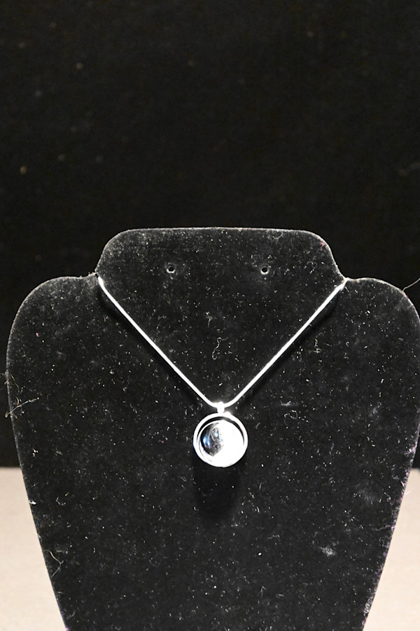 Fused glass black and pearl (yin yang) arc pendant by Susan Mason