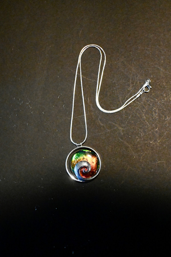 Fused dichroic rainbow swirl pendant by Susan Mason