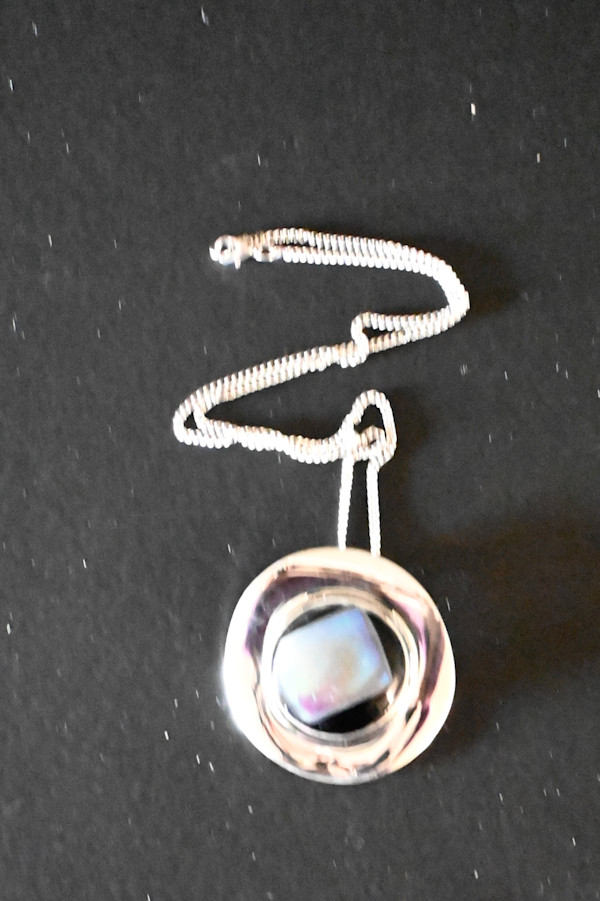 Fused dichroic black and pearl sterling silver wave pendant by Susan Mason