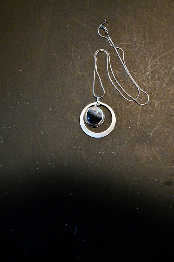 Fused dichroic glass circle drop circle sterling silver setting by Susan Mason