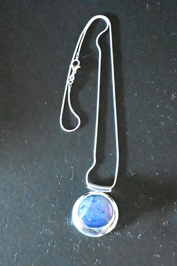 Fused dichroic glass pendant in sterling silver setting by Susan Mason
