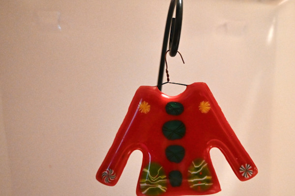 Fused glass red sweater ornament by Susan Mason