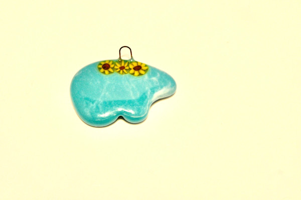 Handmade fused glass Turquoise Spirit Bear with Sunflowers Ornament by Susan Mason, Image 1.