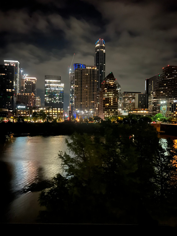 Austin from across the river with Banksy by Marie Louise Bosin