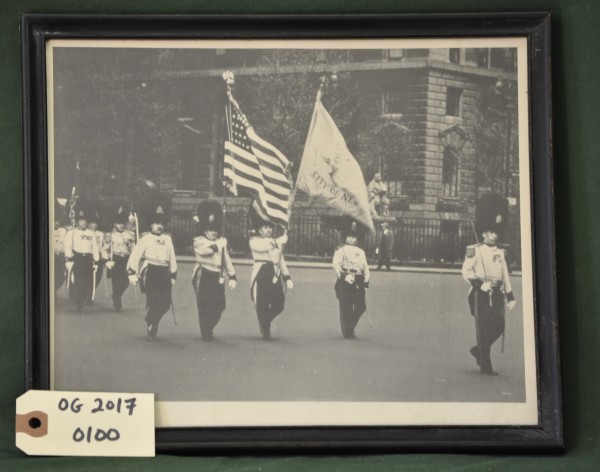 Old Guard Marching on the Street Under the American Flag and Flag of the Old Guard
