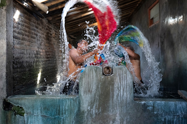 Rinsing Batik by George Salter Photography, Image 1.