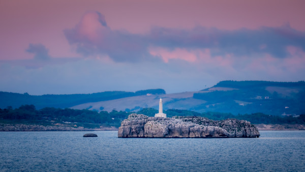 Mouro Island Lighthouse - Under a Pink Sky by Juan Matorras
