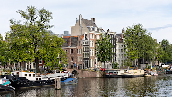 Historic canals in Amsterdam, Netherlands. by David Whited