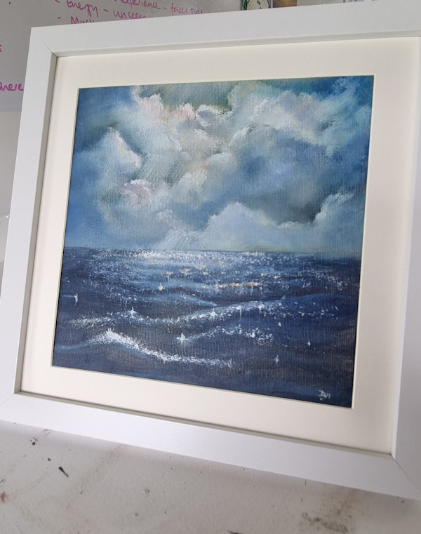 Stormy sky & sunlit water by Debi Garrett, Image 1.