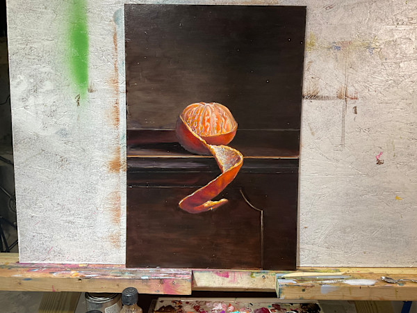 Orange on piano by Rebecca e