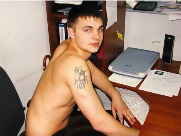 Tattooed guy at desk