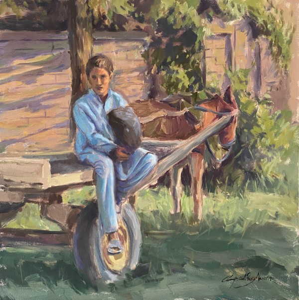 Boy sitting on a cart by Gonzalo Ruiz Navarro
