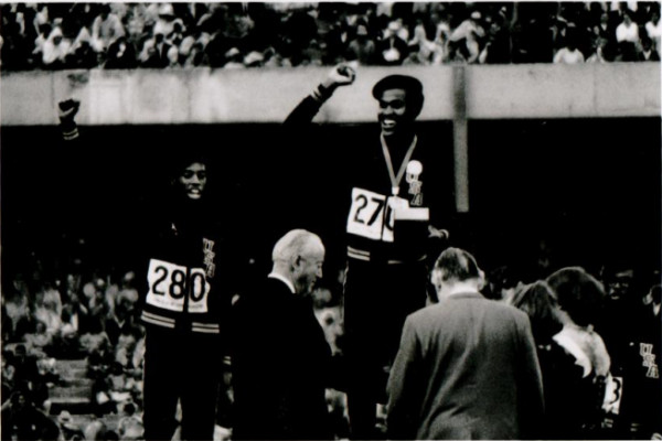 American athletes Larry James, Lee Evans and Ron Freeman (left to right) on the winner's podium for the 400-meter relay at the 1968 Olympic Games by Raymond Depardon