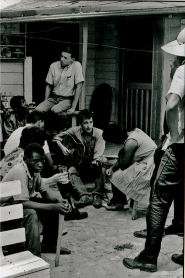 Bob Dylan behind the SNCC office. Greenwood, Mississippi. 1963. by Danny Lyon