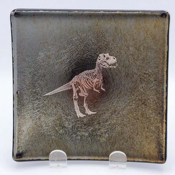 Plate with Silver T-Rex Skeleton on Black Irid by Kathy Kollenburn