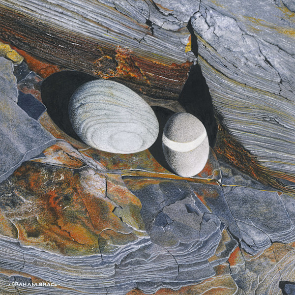 Banded Pebbles on Slate Shelf by Graham Brace