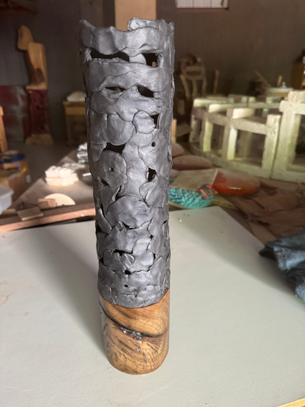 Small round black vase by Brandon Reese