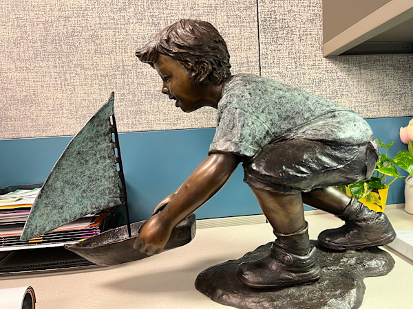 Boy and Sail Boat Sculpture