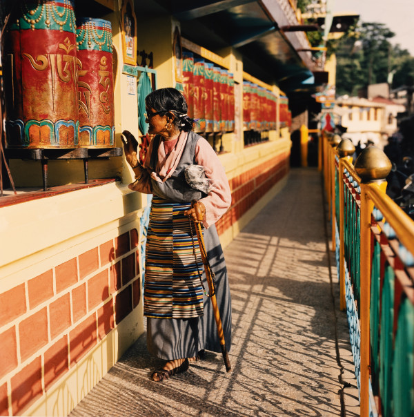 Woman with Prayer Wheels (Dharamsala, India) by Amie Potsic