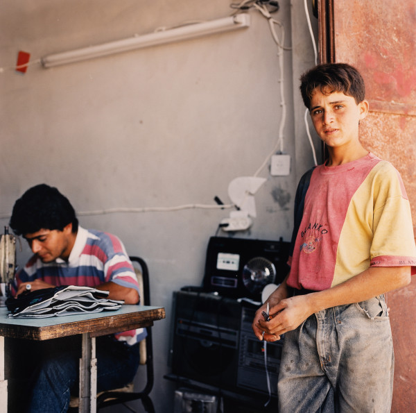Boys Working in Textile Shop (Hebron, Israel) by Amie Potsic