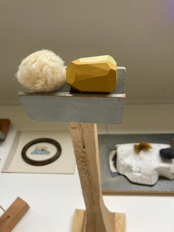 Found Shapes on Tall Wooden Stand by MaryAnn Puls