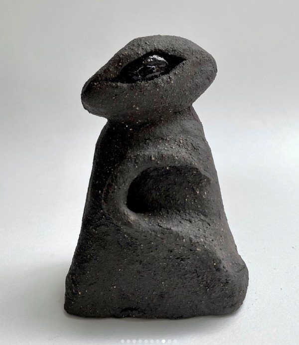 Eye Idol (Single Eye - black glaze on coarse black clay) by Chantal Powell