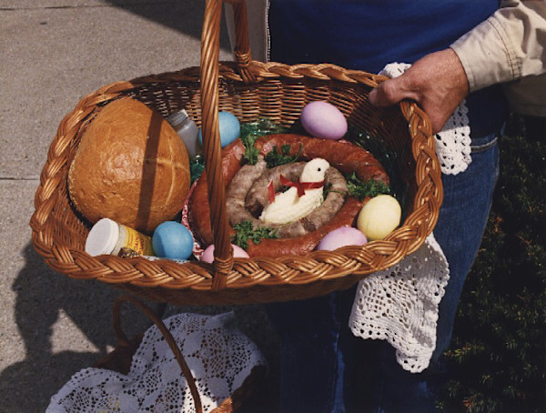 Swienconka: basket with eggs, bread, and hand by Marion Faller