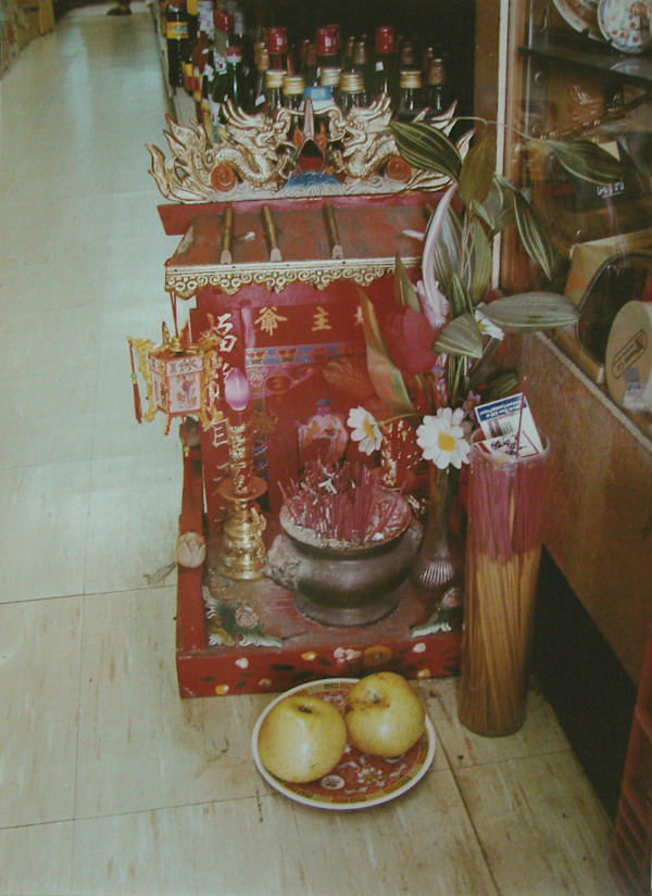 Rochester Asian market: Floor altar, Rochester, New York by Marion Faller