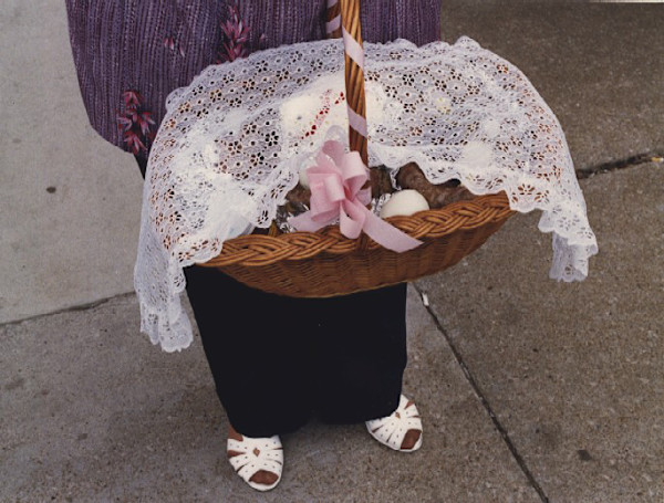 Swienconka:woman holding basket with pink box by Marion Faller