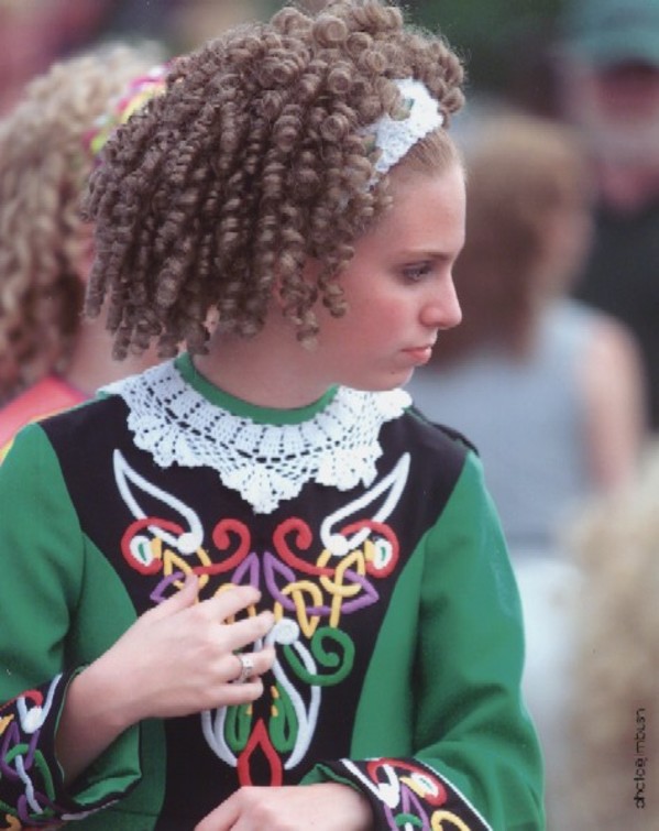 Girl in school costume facing right by Jim Bush