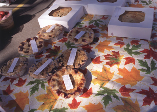 Pies on Maple Leaf Tablecloth, East Aurora Farmers' Market, East Aurora, NY by Marion Faller